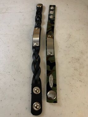 2 Plunder Black Braided & Green Camo Leather Snap Bracelets with Silver Plates.